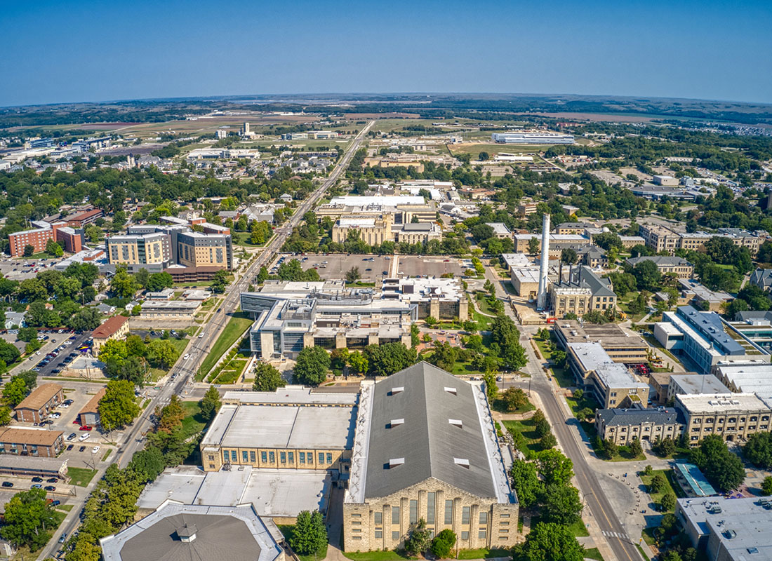 Ashland, KS - Aerial View of Residential Homes and Trees on a Sunny Day