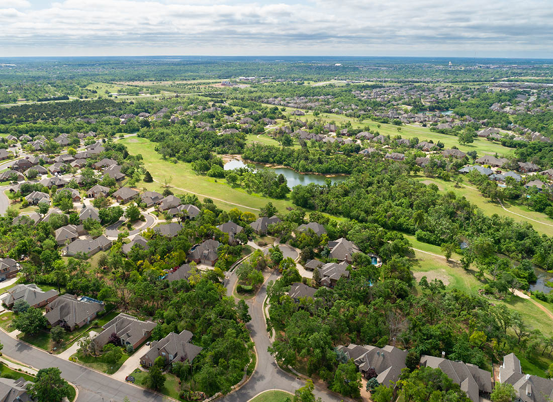 Kingfisher, OK - Aerial View of Residential Homes and Trees and a River